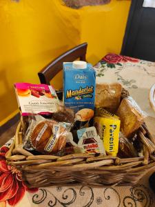 a basket filled with bread and other food on a table at Cerami15 in Catania