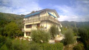 a large house with a balcony on top of it at PETTOCANNELLA in Massa e Cozzile