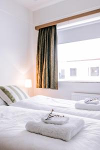 Postel nebo postele na pokoji v ubytování Eldá Guesthouse