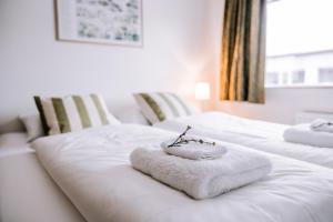Postel nebo postele na pokoji v ubytování Eldá Guesthouse