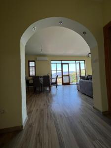 an open living room with a table and a couch at Stunning Adriatic Vista Home in Zelenika