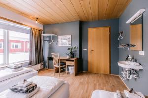 Postel nebo postele na pokoji v ubytování Eldá Guesthouse