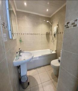 a bathroom with a sink and a toilet at The Mortal Man Inn in Troutbeck