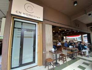 a restaurant with people sitting at tables in front of it at CN Homestay B2 Floor 2 at Nagoya Hill Mall in Nagoya