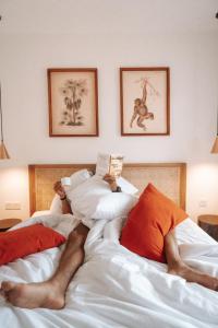 Rúm í herbergi á PORTER HOTEL - Surf & Yoga Retreat