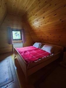 Postel nebo postele na pokoji v ubytování VIKEND KUCA SNJESKO