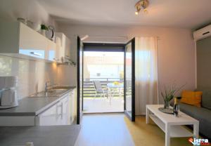 Kuchyňa alebo kuchynka v ubytovaní Dr. IGDA Apartments