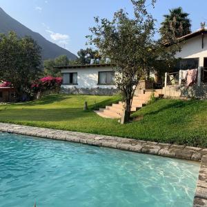 a house next to a river with a house at Casa El Palto in Santa Eulalia