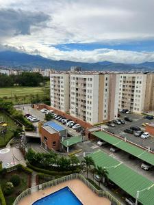 an aerial view of a parking lot with buildings at Valle del lili cozy apartment in Cali +43 photos