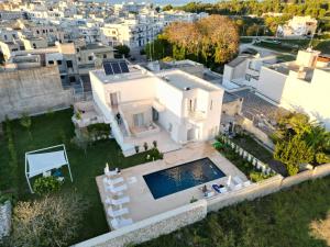 an aerial view of a house with a swimming pool at BluOtranto in Otranto