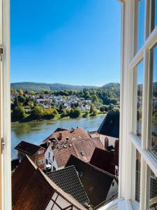 a view of a river from a window at Natur und Neckarblick bei Heidelberg in Hirschhorn