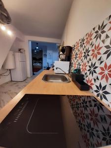 a kitchen with a sink and a counter top at San Amador in Martos