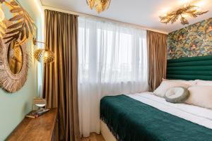 a bedroom with a bed and a large window at HOLT - Leagues and Words Under The Sea in Bucharest