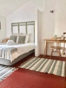 Ein Bett oder Betten in einem Zimmer der Unterkunft Oliveirinha Country House