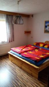 a bedroom with a large bed in a room at Appartement Wechselberger in Neukirchen am Großvenediger