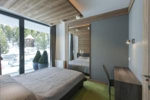 Säng eller sängar i ett rum på Apparthotel Silbersee
