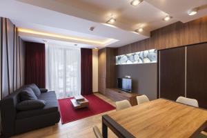 TV a/nebo společenská místnost v ubytování Apparthotel SILBERSEE