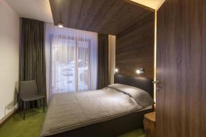 Postel nebo postele na pokoji v ubytování Apparthotel SILBERSEE