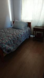 Säng eller sängar i ett rum på Departamento Los Andes