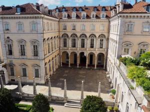 an image of a large building with a courtyard at Mister G home in the heart of Turin in Turin