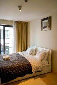 Ένα ή περισσότερα κρεβάτια σε δωμάτιο στο Garden Botanique Apartment