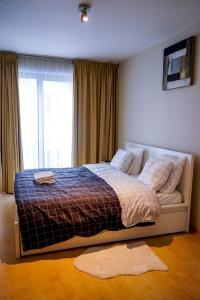 Ένα ή περισσότερα κρεβάτια σε δωμάτιο στο Garden Botanique Apartment