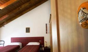 Postel nebo postele na pokoji v ubytování Albergo Cavallino