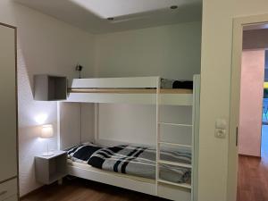 a bedroom with a bunk bed in a room at Bakker Huus EG in Emden