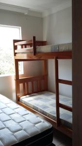 En eller flere senge i et værelse på Águas da Serra com acesso ao rio e vista pra serra + 30 billeder