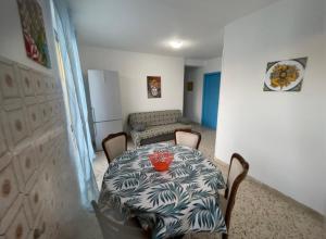 a room with a table with a bowl on it at Appartamento Ponente in Balestrate
