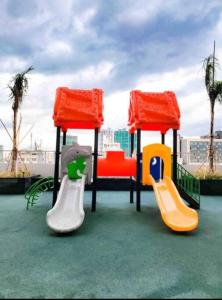 a playground with three slides at StayInMyCondo - 8th Condo in Pasay near NAIA Airport, MOA Pasay in Manila