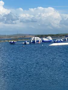 a group of boats in a large body of water at Port Haverigg Holiday Village in Millom