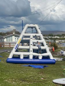 a boy is on a slide in a playground at Port Haverigg Holiday Village in Millom