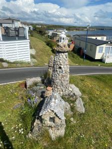 a rock lighthouse on the side of a road at Port Haverigg Holiday Village in Millom