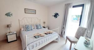 Łóżko lub łóżka w pokoju w obiekcie El Gueco Holiday Apartment