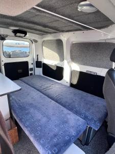 a bed in the back of a camper van at Cheap Camper Van in Iceland in Reykjavík