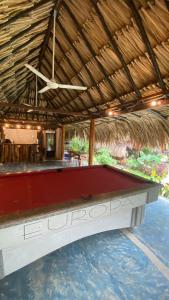 a pool table in the middle of a resort at WAYANAY TAYRONA ECO HOSTEL in El Zaino