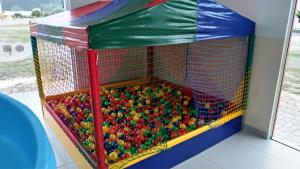 a play room filled with lots of balls at Pousada Divino Oleiro - Gov. Celso Ramos in Governador Celso Ramos