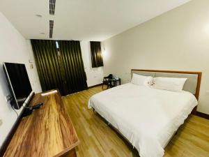 Krevet ili kreveti u jedinici u objektu 浯島文旅WD Hotel