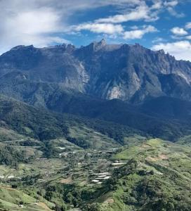 a view of a mountain range with a valley at D'TERRACE KUNDASANG in Ranau