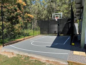a basketball court with a net and a hoop at The Farm On Razorback Ridge in Montville