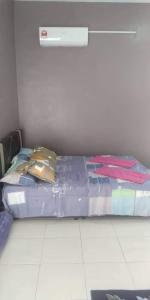 Ένα ή περισσότερα κρεβάτια σε δωμάτιο στο Ema roomstay