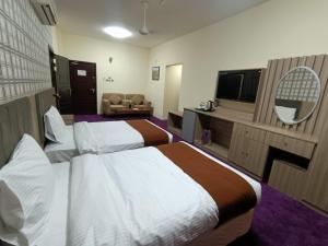 Letto o letti in una camera di ROYAL HOTEL