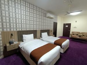 Letto o letti in una camera di ROYAL HOTEL