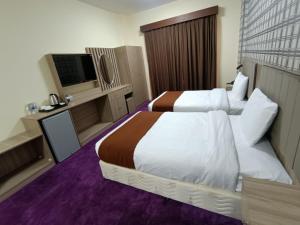 Letto o letti in una camera di ROYAL HOTEL