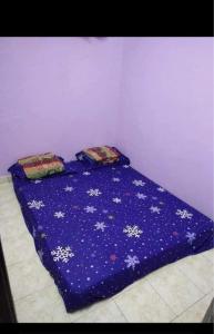 Una cama o camas en una habitación de G4 Flats Family Homestay