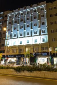 a large building with a lit up facade at Hotel Urban Dream Granada in Granada