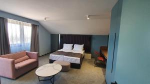 Letto o letti in una camera di HABAKUK Wellness & Event Hotel