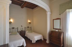 Posteľ alebo postele v izbe v ubytovaní Wonderful villa in Montepulciano