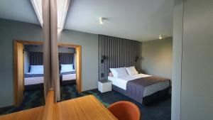 Letto o letti in una camera di HABAKUK Wellness & Event Hotel